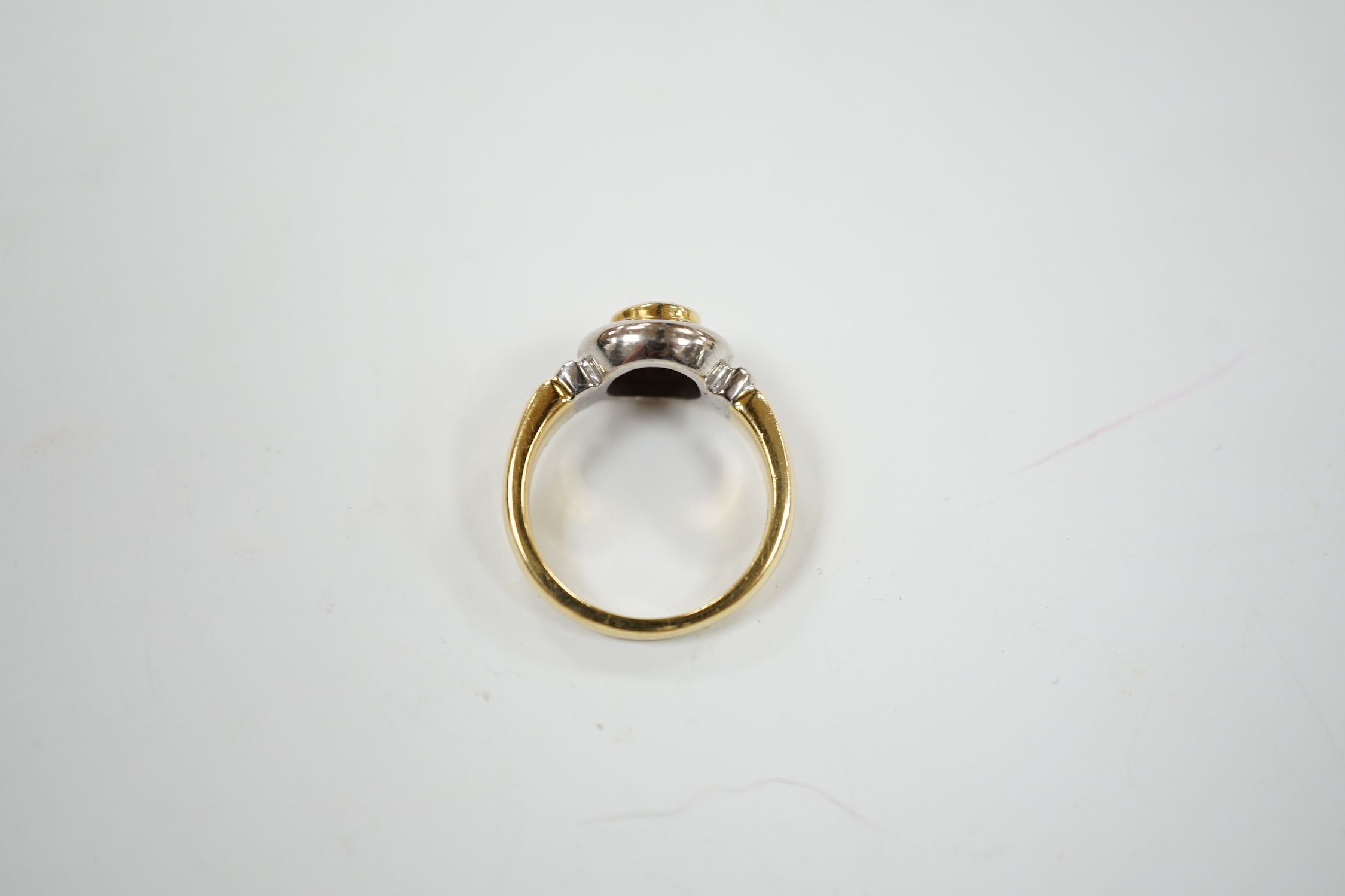 A modern 18ct gold and collet set solitaire diamond ring, with engraving to commemorate the Millenium Dome, the stone weighing 0.40ct, size J, gross weight 6.7 grams.